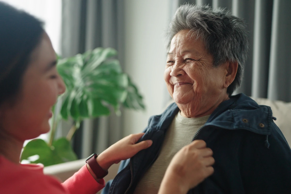 Caregiver assisting resident at The Ivy of McKinney Senior Living TX